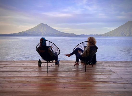 students overlooking lake and volcanoes